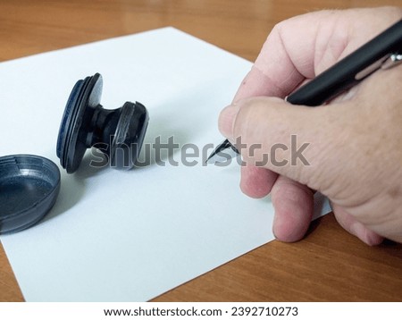 Sheet of paper pen and stamp dejat on the desk Corporate Document Template