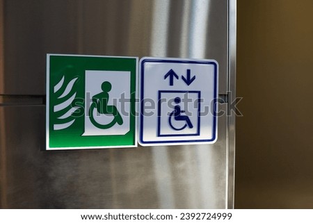 Wheelchair and fireproof elevator sign for people with disabilities. Symbol to help people evacuate a building