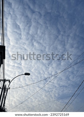 nice clouds in the blue sky Royalty-Free Stock Photo #2392725169