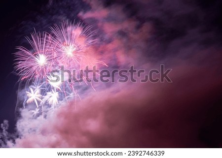 Particulate matter and carbon dioxide exposure from New Year's Eve fireworks. Climate change due to air pollution harms the environment. Royalty-Free Stock Photo #2392746339