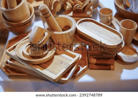 Wooden kitchenware and decorations sold on market. wooden utensils. natural wood kitchen utensils - plates and supplies.