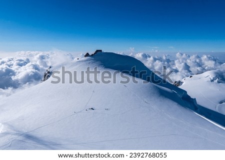 Switzerland, Panoramic view on Snow Alps and Blue Sky around Titlis mountain. Monte rosa or Dufourspitze Royalty-Free Stock Photo #2392768055
