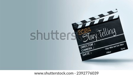 Storytelling in the year 2024. Happy New Year to film industry and content creators. Royalty-Free Stock Photo #2392776039