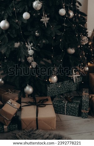 a christmas tree with presents under it