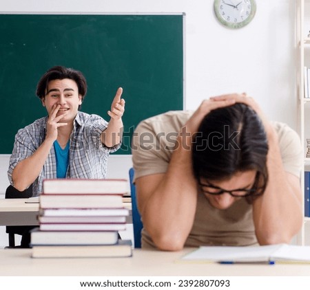 Two male students in the classroom Royalty-Free Stock Photo #2392807093