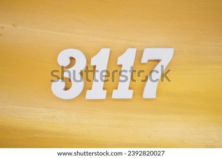 The golden yellow painted wood panel for the background, number 3117, is made from white painted wood.