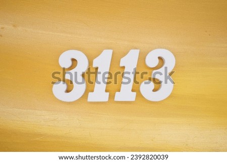 The golden yellow painted wood panel for the background, number 3113, is made from white painted wood.