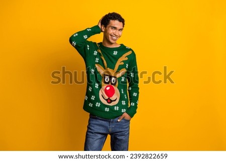 Photo of good mood cheerful guy dressed christmas ugly print pullovers smiling hand head isolated yellow color background