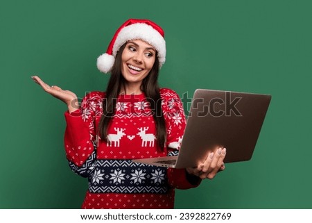 Photo of positive excited lady santa helper dressed print xmas sweater talking modern gadget isolated green color background