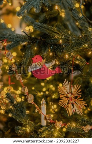 A close up of a Christmas tree with ornaments 