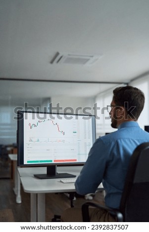 Busy business man trader broker analyst investor analyzing stock exchange trade crypto market using pc computer digital data investing finances in stockmarket working in dark office. Vertical Royalty-Free Stock Photo #2392837507