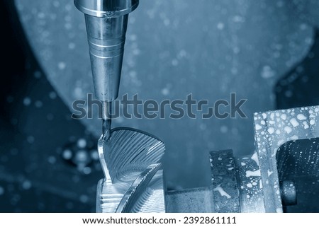The 5 axis machining center cutting the boat propeller parts  parts with taper ball end mill tool. The hi-precision parts  manufacturing process by multi-axis CNC milling machine. Royalty-Free Stock Photo #2392861111