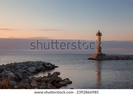 Old Finnish lighthouse Vuohensalo near the shore of Lake Ladoga. Motornaya Bay, Leningrad Region, Russia Royalty-Free Stock Photo #2392866985
