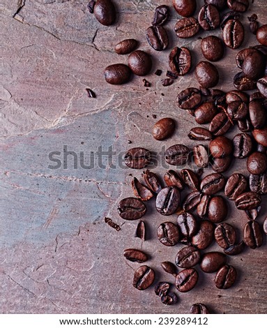 Coffee Beans on a slate background. Close-up. Top view. Copy space. 