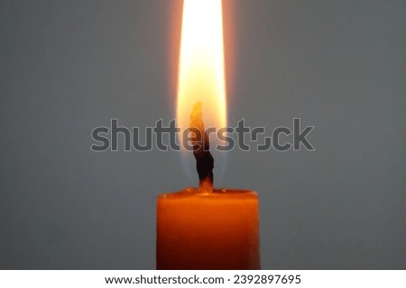 Close up of a glowing candle