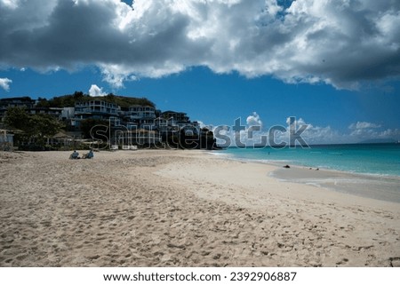 relaxing on the beach of the Caribbean island of Antigua in winter among palm trees and white beaches