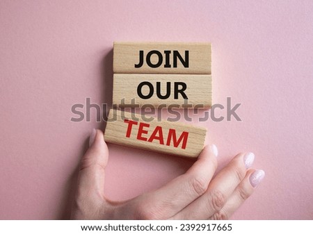 Join our team symbol. Wooden blocks with words Join our team. Businessman hand. Beautiful pink background. Business and Join our team concept. Copy space.