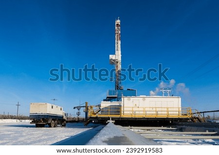 Drilling rig in oil field for drilled into subsurface Royalty-Free Stock Photo #2392919583