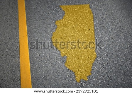 yellow map of illinois state on asphalt road near yellow line. concept