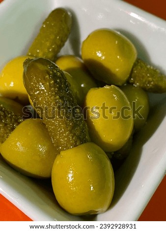 Close-up of some olives with pickle.