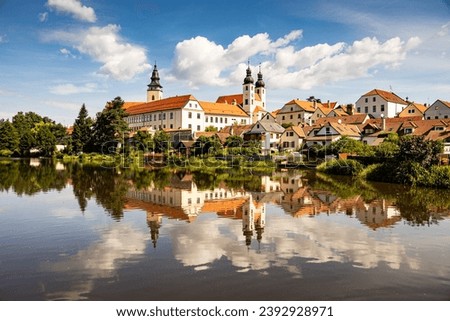 Telc town with castle on background and lake on foreground