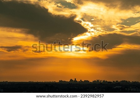 Sky beautiful hot summer background. Detailed clouds at sunrise. Sunny yellow and white sky and beautiful fluffy puffy cloudscape Clean of bugs, and dust. Royalty-Free Stock Photo #2392982957
