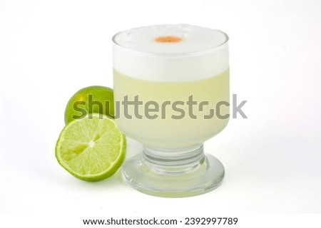 Peruvian food: A glass of the traditional Peruvian national cocktail called Pisco sour. Royalty-Free Stock Photo #2392997789