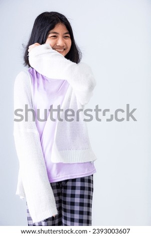 Young Asian girl isolated on colored background,Cute asian woman in color casual dress thinking and imagination isolated on pink background