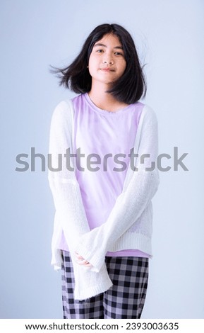 Young Asian girl isolated on colored background,Cute asian woman in color casual dress thinking and imagination isolated on pink background