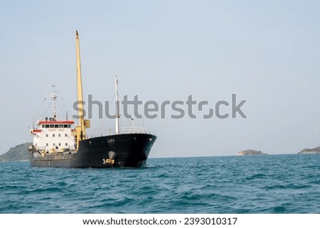 cargo ship in the ocean for export import goods from cargo yard port to customs ocean concept freight shipping by ship