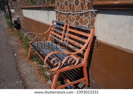 View of a bench on the side of the road