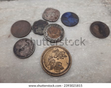 Indian Old vintage coins. Indian old and new coins isolated on white background. Valid and invalid Indian currencies. Old Indian Currency old Coin  Royalty-Free Stock Photo #2393021815
