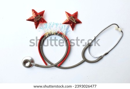 medical stethoscope with  decorated Beautiful headband funny red star isolate on a white backdrop. Background for congratulations to doctors.  life christmas and new year holidays.