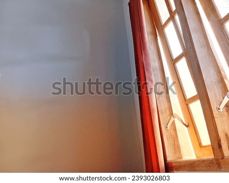 Handmade wooden windows decorated with curtains