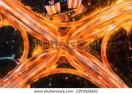 aerial view of city overpass at night, elevated road junction closeup in shanghai  Royalty-Free Stock Photo #2393028681