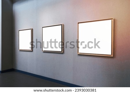blank picture frames with clipping path on exhibition wall