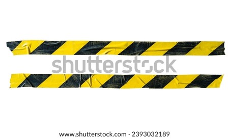 Distressed yellow and black barricade tape on white background with clipping path