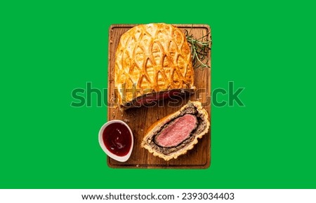 Sliced Beef Wellington with the  sauce on Green Screen