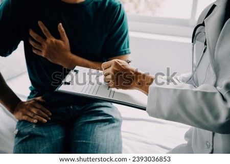Doctor telling to patient woman the results of her medical tests. Doctor showing medical records to cancer patient in hospital ward. Senior doctor explaint the side effects of the intervention. Royalty-Free Stock Photo #2393036853