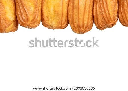 Sweet eclairs isolated on a white background. Top view.  Royalty-Free Stock Photo #2393038535