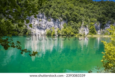 View of the beautiful picturesque waterfalls on Plitvice Lakes. Rocks and green trees around lakes with blue water. Breathtaking view in the Plitvice Lakes National Park .Croatia