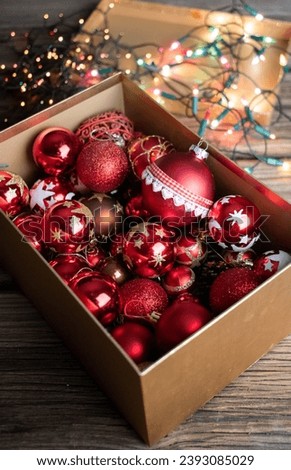 red Christmas decorations in a box