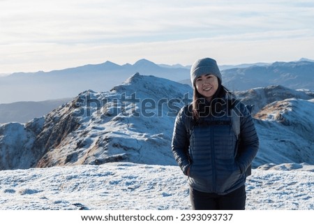 Female hiker on the Tarmachan ridge, Scotland Royalty-Free Stock Photo #2393093737