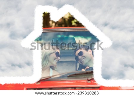 Loving couple in their red cabriolet having a ride against cloudy sky