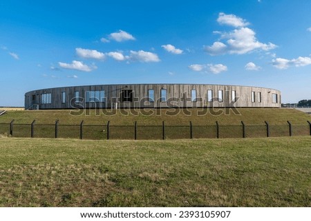  Immigration transit centre "Caricole" circular building inside fenced area near Brussels International Airport, Zaventem, Belgium Royalty-Free Stock Photo #2393105907