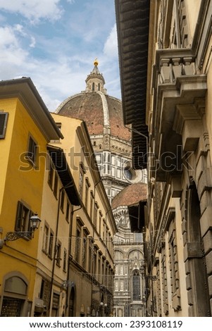 Florence Cathedral facade in Italy - Duomo di Firenze. Beautiful religious building with cloudy sky