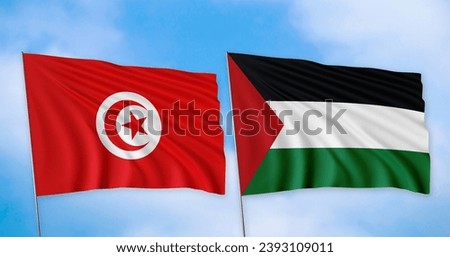 The Tunisian and Palestinian flags are lined up, with a clear sky in the background