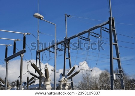 Electricity system of the city on the outskirts, high voltage lines, supply of electricity to apartments and houses, high costs of electricity Urban power supply, Electricity distribution, Outskirts  Royalty-Free Stock Photo #2393109837