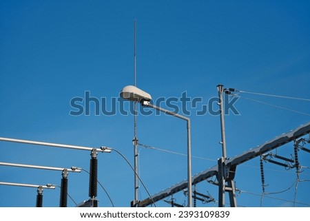 Electricity system of the city on the outskirts, high voltage lines, supply of electricity to apartments and houses, high costs of electricity Urban power supply, Electricity distribution, Outskirts  Royalty-Free Stock Photo #2393109839