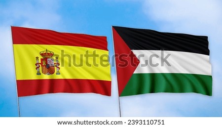 The flags of Spain and Palestine are lined up, with a clear sky in the background